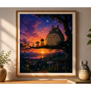 May include: A framed print of a sunset scene featuring characters from the animated film, My Neighbor Totoro. The artwork depicts Totoro and other characters on a tree branch, overlooking a vibrant sunset with a crescent moon.