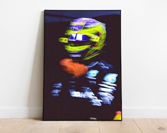 May include: A blurry image of a person wearing a racing helmet with a yellow, green, and purple design. The helmet has a black visor and the person is wearing a black racing suit with blue and white accents.