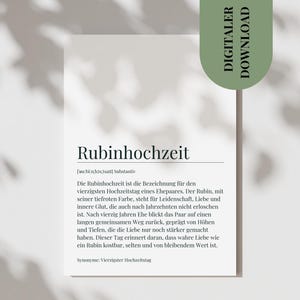 May include: A white print with the German word "Rubinhochzeit" and text describing a 40th wedding anniversary. A green "DIGITALER DOWNLOAD" sticker is on the right. The print is on a white surface with shadows.