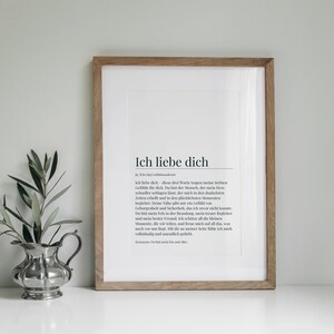 May include: A framed print with a white background and black text. The text reads "Ich liebe dich" which is German for "I love you". The text is a definition of the word "love" in German.