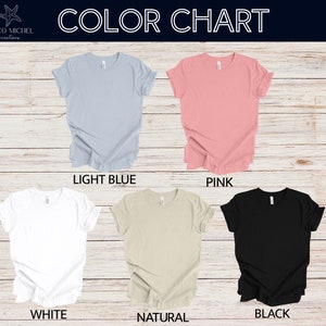 May include: Colour chart showing five different t-shirt colours: light blue, pink, white, natural, and black.