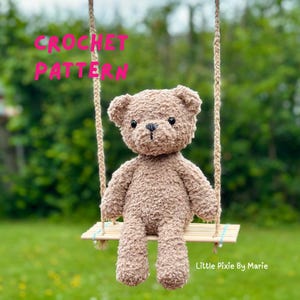 May include: A crocheted brown teddy bear sits on a small wooden swing. The bear has a textured, fuzzy appearance with black button eyes and a stitched nose. The words "CROCHET PATTERN" are in pink text above the bear. The background is green.