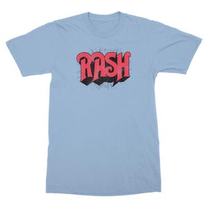 May include: A light blue t-shirt with a red and black graphic of the word "RASH" in a retro font.