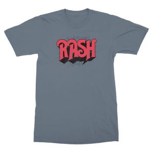 May include: A blue t-shirt with a red "RASH" graphic in a retro font style.