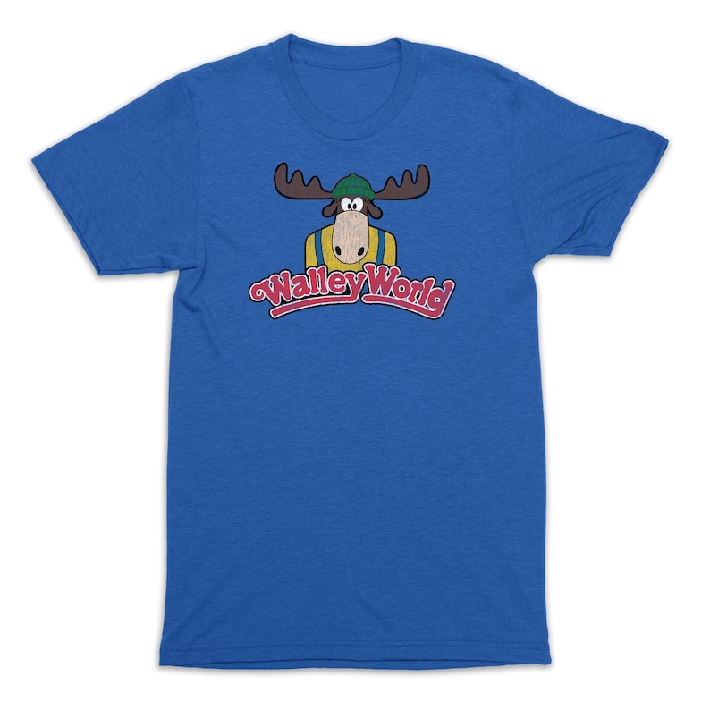 May include: A royal blue t-shirt with a vintage-style graphic of a cartoon moose wearing a hat and overalls. The text "Walleye World" is printed in red and yellow below the moose.