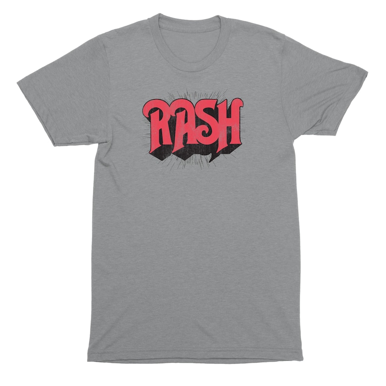 May include: A heather grey t-shirt with a red and black graphic of the word "RASH" in a retro font.