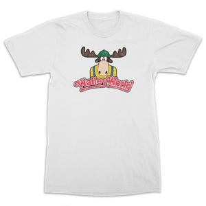 May include: White t-shirt with a vintage-style logo for "Wally World" featuring a cartoon moose wearing a green hat and a yellow shirt.