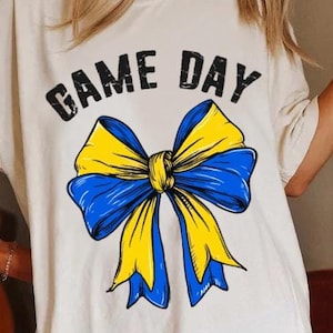 Blue and yellow football png, coquette bow football png, cheer football png, game day png, Football Season png, Blue and gold, Sport png