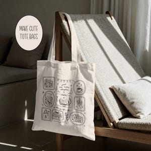 May include: A cream-colored canvas tote bag featuring black line art illustrations of books, a coffee cup, and a cozy chair. The central text reads, "just one more chapter," surrounded by decorative frames, hearts, and string lights.
