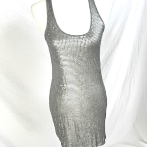 Vintage-ish racer back, sporty matte silver sequin mini dress, scooped neckline, it&#39;s a cute and funky little piece! Shown on 4/6 dress form