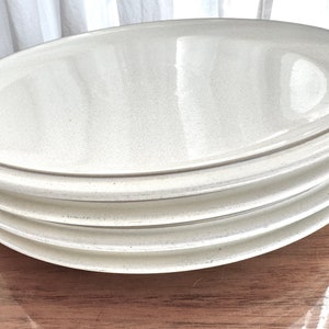 Set of four white Denby England Energy pattern dinner plates with celadon stripe around rim, great shape, no chips or cracks, handcrafted