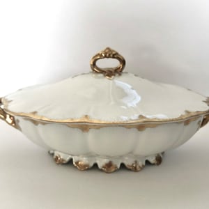 12” Haviland France Limoges white with gold rim vegetable serving bowl with lid. Style 22774. One small chip on bottom of lid as shown