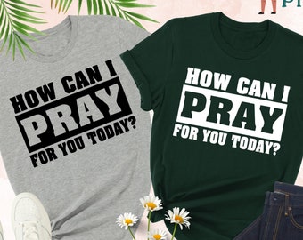 May include: Two t-shirts with the text "How Can I Pray For You Today?" printed on them. One shirt is grey and the other is green.