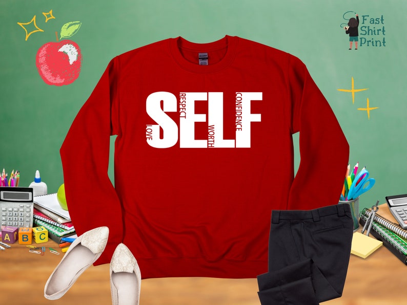May include: Red long-sleeve sweatshirt with the word "SELF" in white letters. The letters are made up of the words "LOVE", "RESPECT", "WORTH", and "CONFIDENCE".
