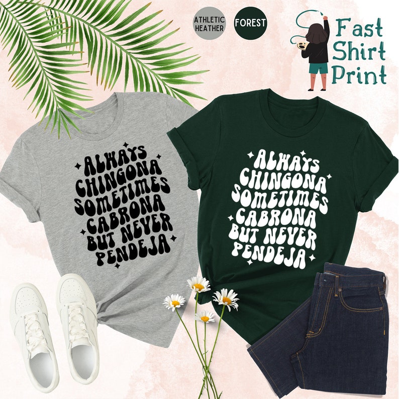 Puede incluir: Dos camisetas con el texto "Always Chingona Sometimes Cabrona But Never Pendeja" en una fuente retro. Las camisetas son de color gris jaspeado deportivo y verde bosque.