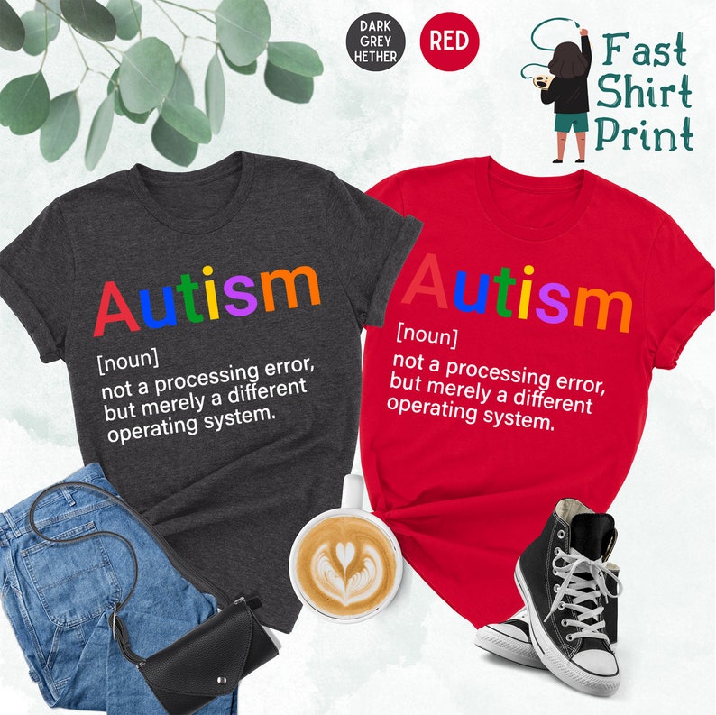 May include: Two t-shirts with the word "Autism" printed in rainbow colors. The text below the word defines autism as "not a processing error, but merely a different operating system."