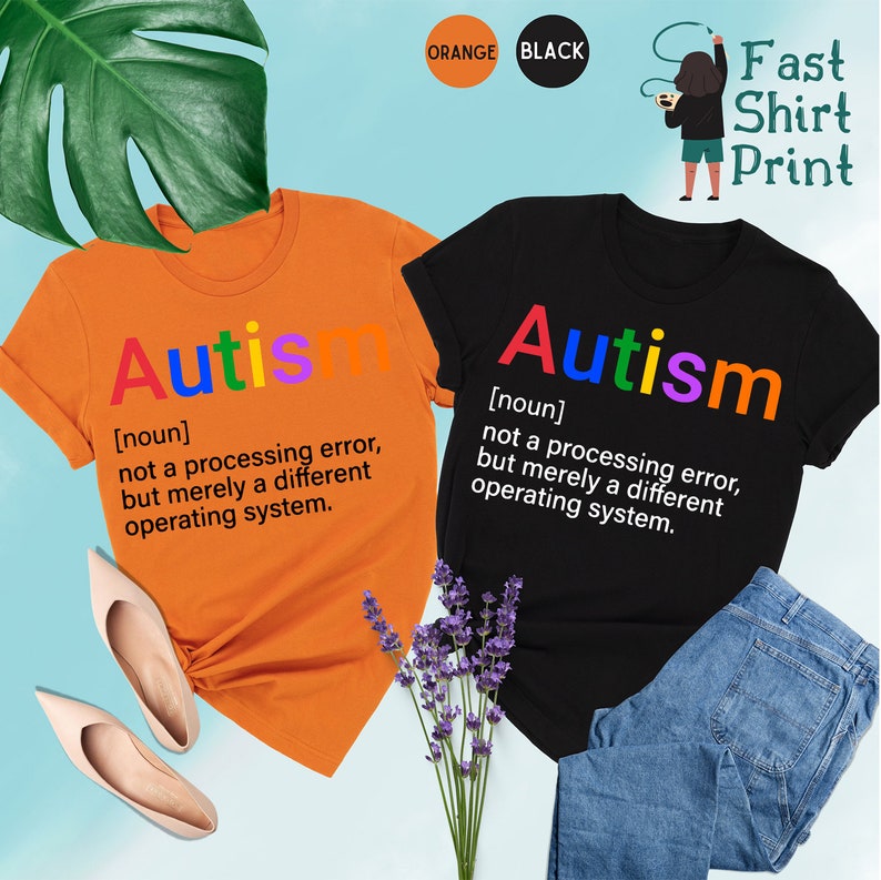 May include: Two t-shirts, one orange and one black, with the word "Autism" printed in rainbow colors. The text below the word defines autism as "not a processing error, but merely a different operating system."
