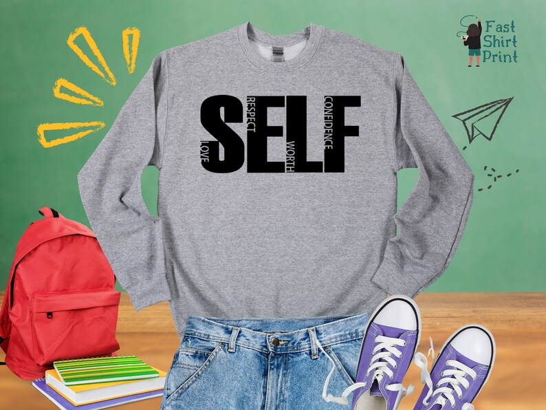 May include: Gray sweatshirt with the word "SELF" in black letters. The letters are made up of the words "respect", "love", "confidence", and "worth".