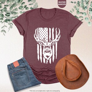 a t - shirt with an american flag and a deer's head