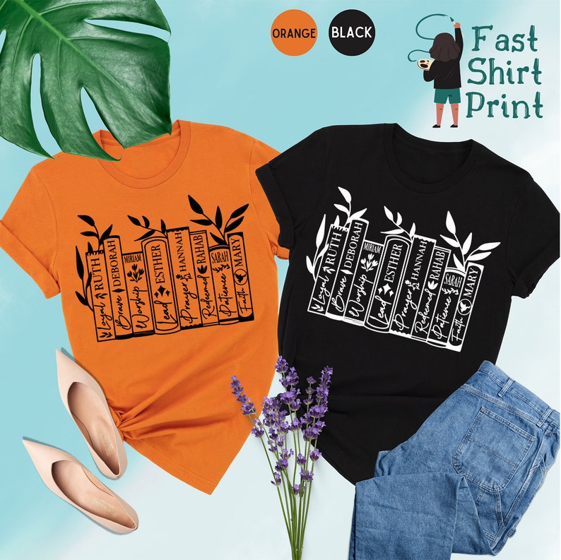 May include: Two t-shirts, one orange and one black, each with a graphic of stacked books and the words "Loyal, Ruth, Brave, Deborah, Worship, Lead, Esther, Prayer, Hannah, Redeemed, Rahab, Patience, Faith, Mary." The text "Fast Shirt Print" is also visible.