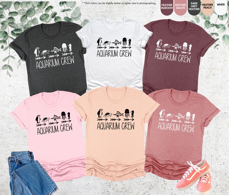 a group of four t - shirts with different designs on them