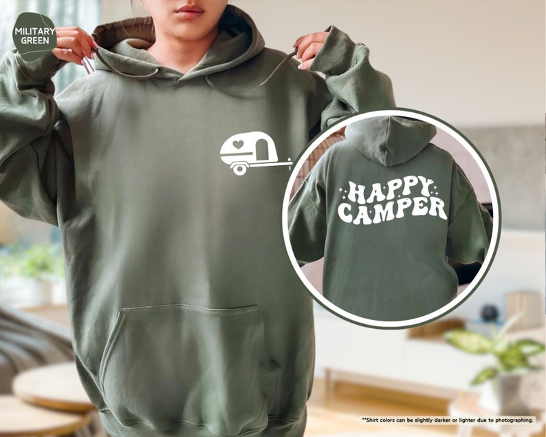 a woman wearing a green happy camper hoodie
