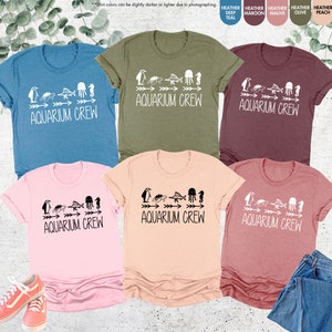 a group of t - shirts with the words aquariusam green on them