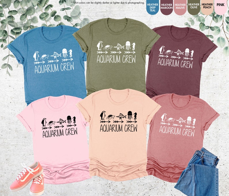 a group of t - shirts with the words aquariusam green on them