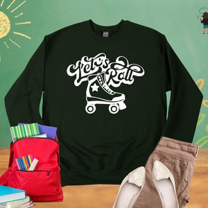 May include: A dark green sweatshirt with white text that says "Let's Roll" and a white roller skate graphic.