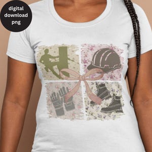May include: A white t-shirt with a pink ribbon and a collage of images related to construction work. The images include a hard hat, work boots, gloves, and a silhouette of a person working on a power line.