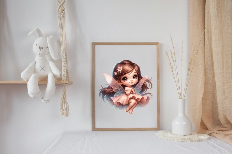 May include: A digital illustration of a fairy with pink wings and a pink dress. The fairy has brown hair and large blue eyes. The illustration is framed in a light wood frame.
