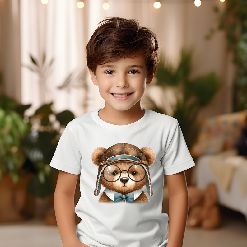 May include: A white t-shirt with a brown bear wearing a brown aviator hat, round glasses, and a blue bow tie.