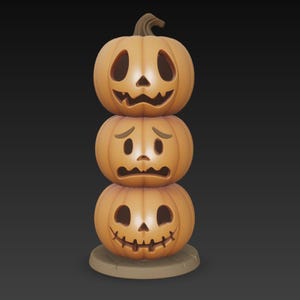 May include: A stack of three orange pumpkins with carved faces, each displaying a different expression: smiling, sad, and happy. The pumpkins are stacked on top of each other, creating a Halloween-themed decoration.