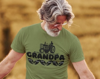 May include: A green t-shirt with a black tractor graphic and the text "My favorite people call me Grandpa".