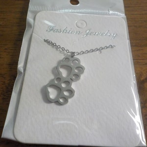 Silver double paw print necklace