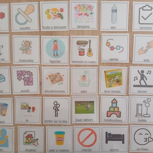 May include: A collection of thirty square communication cards featuring colorful icons and French text labels. Each card displays a simple illustration representing daily activities, objects, or actions, organized in a grid layout on a light surface.