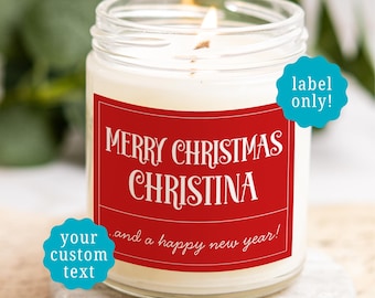 May include: A clear glass jar candle with a white wax fill and a lit wick. The jar features a rectangular red label with white text that reads Merry Christmas Christina and a happy new year. Two blue circular badges overlay the image.