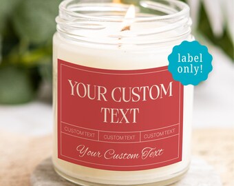 May include: A clear glass jar candle with a lit wick and a red rectangular label featuring the text YOUR CUSTOM TEXT, CUSTOM TEXT, and Your Custom Text. A teal circular sticker with the white text label only! is attached to the side.