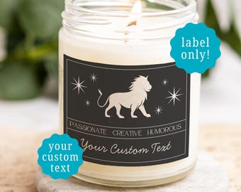 May include: A clear glass jar candle with a white wax fill and a lit wick. The black rectangular label features a white lion graphic, star icons, and the text PASSIONATE CREATIVE HUMOROUS, with a space for Your Custom Text below.