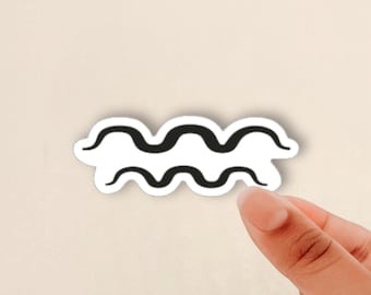 May include: A die-cut sticker featuring a black graphic design of two parallel horizontal wavy lines, representing the Aquarius zodiac symbol. The sticker has a white border and is shaped to follow the contour of the black wavy lines.