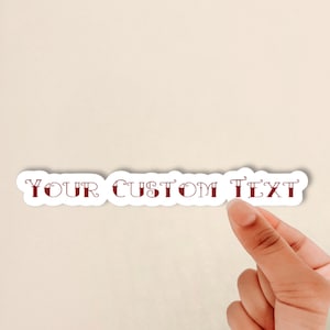 May include: White sticker with a red outline and the text "YOUR CUSTOM TEXT" in a decorative font.