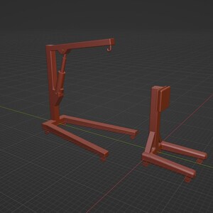 May include: Two orange-red metal shop cranes. The larger crane has a hook and a hydraulic lift. The smaller crane has a vertical support and a base with two forks. Both are on a dark gray grid.