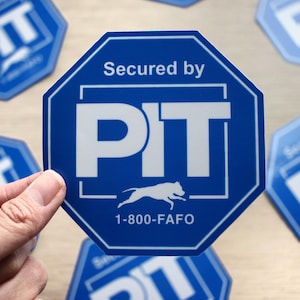 May include: A blue octagon-shaped sticker with white text that reads "Secured by PIT" and a white silhouette of a dog running. The phone number 1-800-FAFO is printed below the dog.