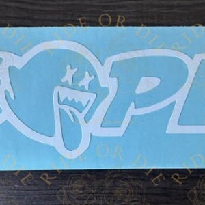 May include: White vinyl sticker with the word "DOPE" in a stylized font. The letter "O" is replaced with a cartoon ghost with a mischievous grin and crossed eyes.