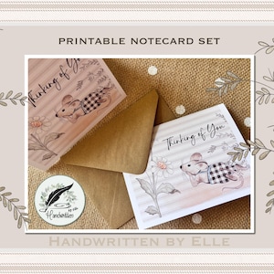 May include: A printable notecard set featuring a mouse wearing a black and white buffalo check vest, lying next to a daisy. The cards display the text Thinking of You. A brown envelope is included, along with a circular logo reading Handwritten by Elle.