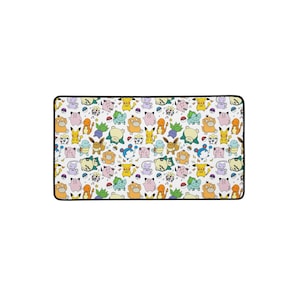May include: Rectangular mousepad featuring a colorful pattern of various cartoon characters on a white background. The characters are in shades of yellow, orange, blue, green, and purple. The mousepad has a black border.