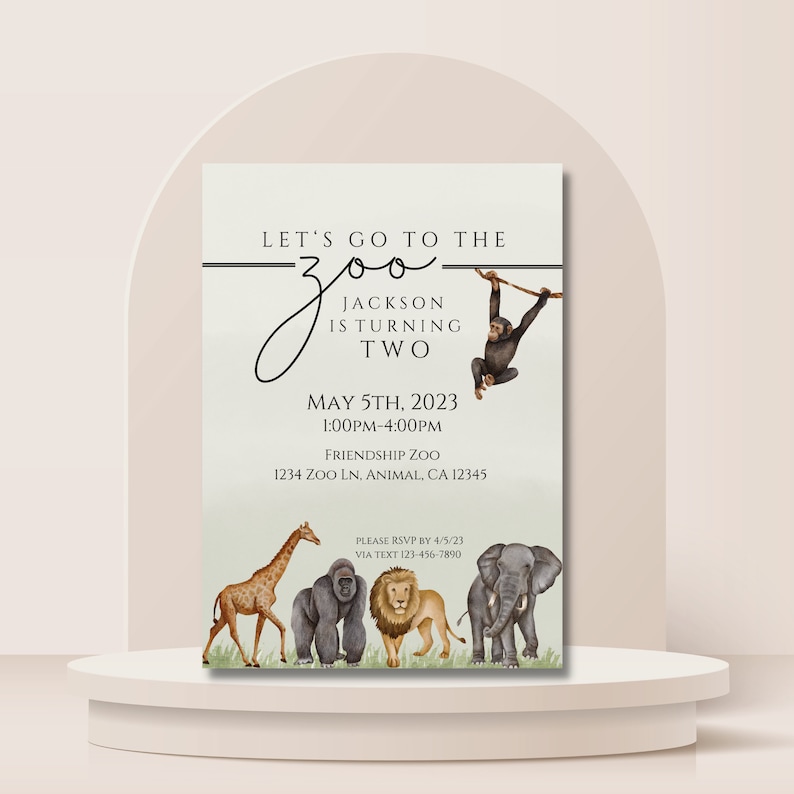 May include: A birthday invitation for a child turning two years old. The invitation features a watercolor illustration of a jungle scene with animals like a giraffe, gorilla, lion, and elephant. The text on the invitation reads "Let's go to the zoo, Jackson is turning two, May 5th, 2023, 1:00pm-4:00pm, Friendship Zoo, 1234 Zoo Ln, Animal, CA 12345, Please RSVP by 4/5/23, Via text 123-456-7890."