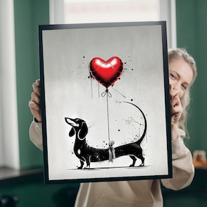 May include: Black and white illustration of a dachshund dog with a red heart-shaped balloon tied to its tail. The background is a gray wash with black splatters.