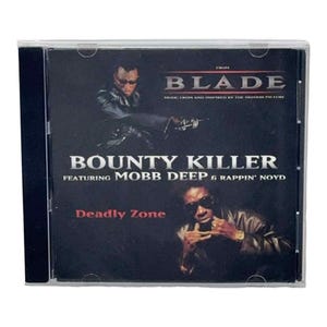 May include: A CD case for the soundtrack "Blade" featuring "Bounty Killer" with Mobb Deep & Rappin' Noyd. The cover is black with images of people wearing sunglasses and the text "Deadly Zone".