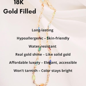 May include: A gold-filled bracelet with colourful, oval-shaped gemstones. The bracelet is labelled "18K Gold Filled" and features text highlighting its long-lasting, hypoallergenic, and water-resistant qualities. The text also mentions its real gold shine and affordable luxury.